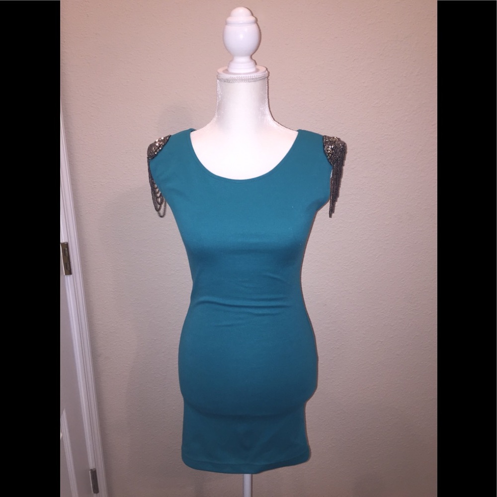Beautiful dress with intricate shoulder detail.